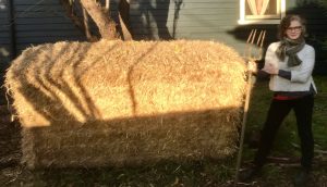 melinda with a giant straw bale